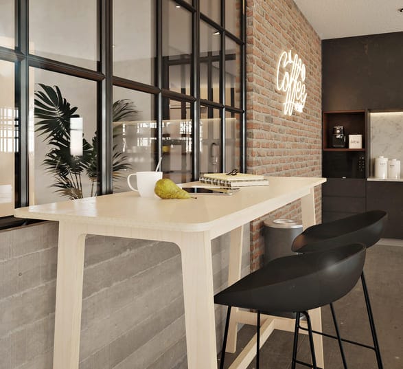 table haute en bois clair avec des chaises noires dans une cuisine d’entreprise type industriel