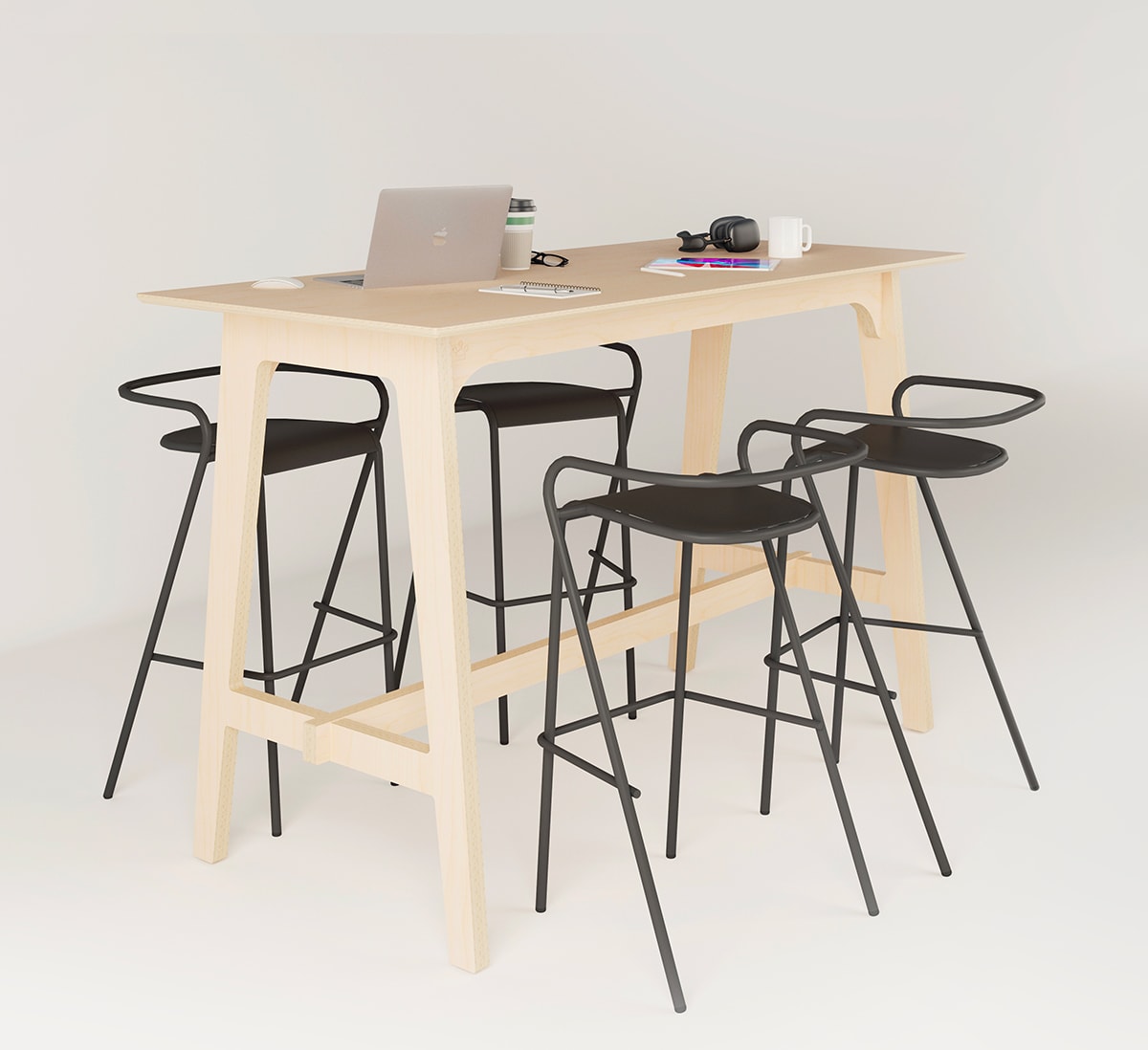 table haute en bois clair avec un ordinateur et quatre chaises hautes noires